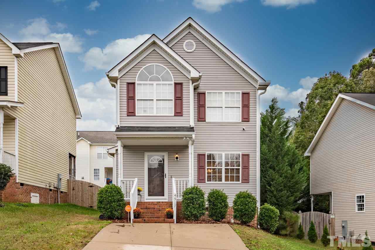 4917 Windproof Way Raleigh, NC 27616 - Photo 1 of 18 a front view of a house with garden