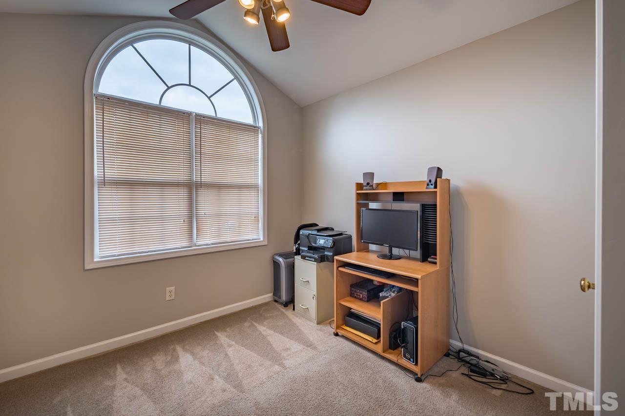 4917 Windproof Way Raleigh, NC 27616 - Photo 13 of 18 an empty room with windows dryer and fireplace