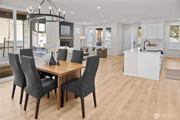 a kitchen with sink a stove and cabinets