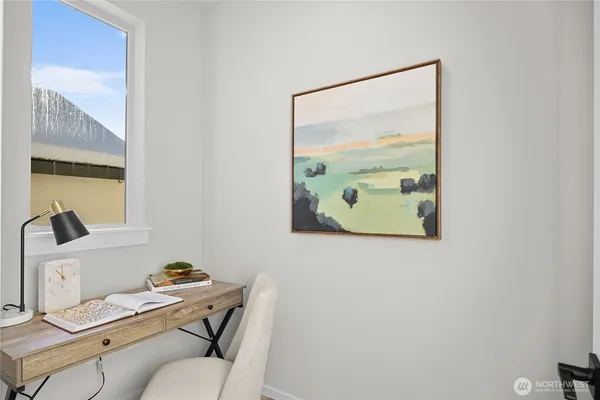 a view of a hallway with wooden floor and entryway