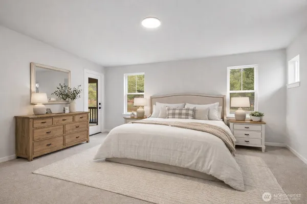 a spacious bedroom with a bed a dresser and a large mirror