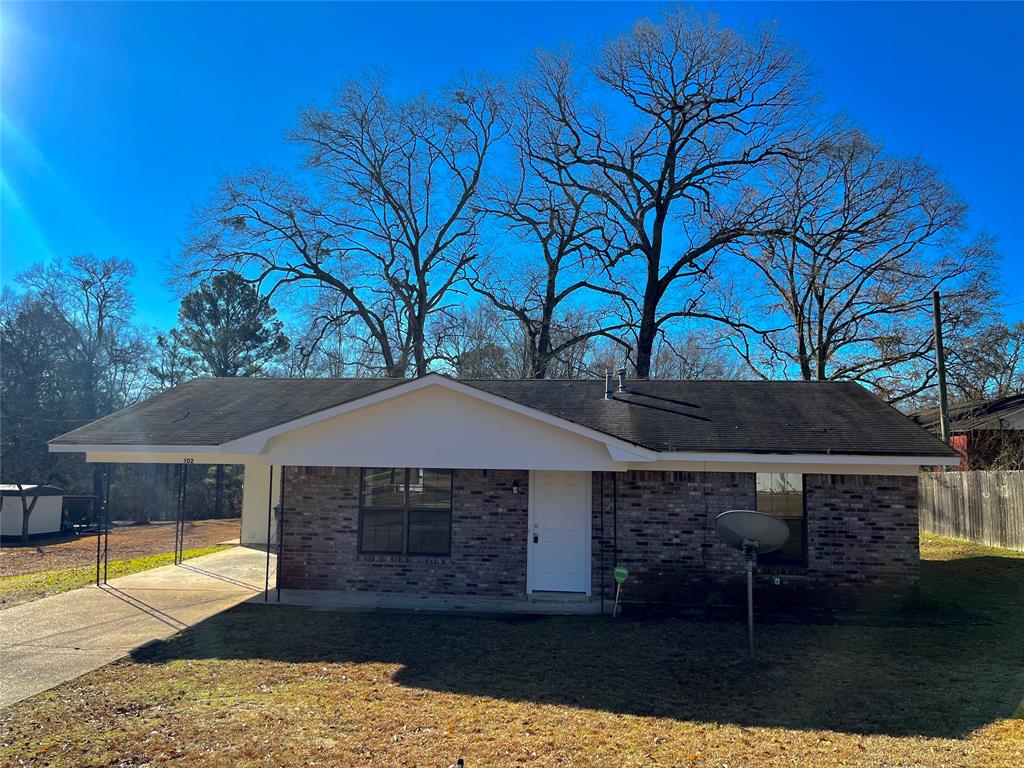 102 Azalea Street Minden, LA 71055 - Photo 1 of 1 Ranch-style home with a carport and a front yard