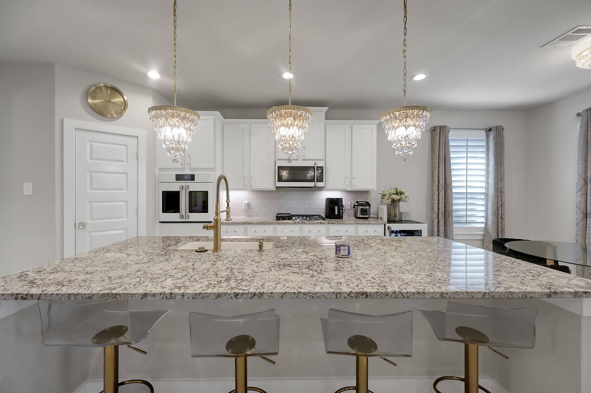 3131 Red Buckeye Lane Conroe, TX 77301 - Photo 13 of 34 a kitchen with cabinets and window
