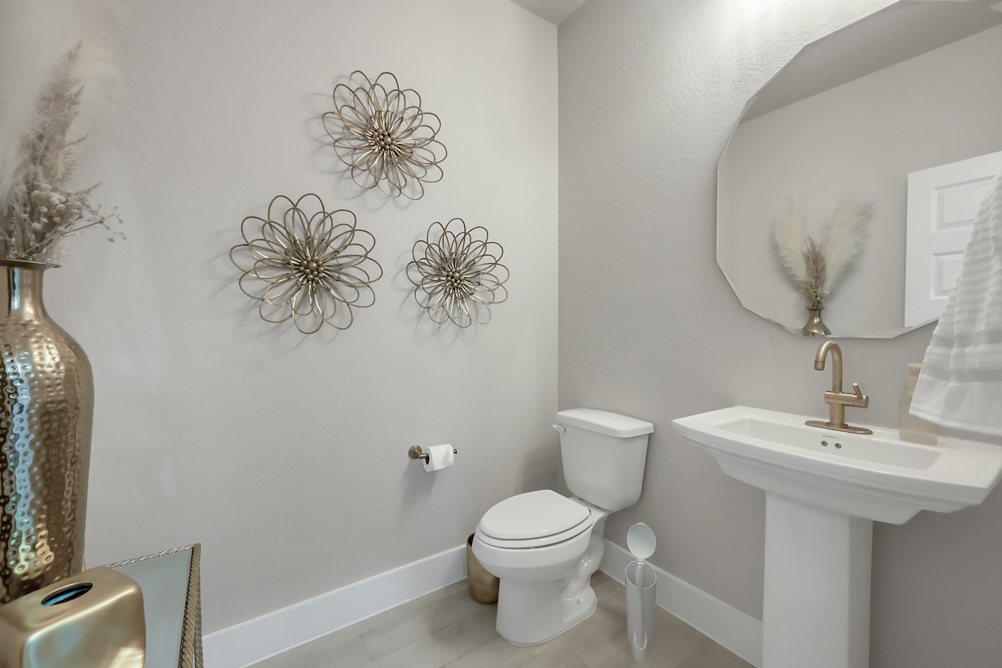 3131 Red Buckeye Lane Conroe, TX 77301 - Photo 15 of 34 a bathroom with a toilet sink and mirror