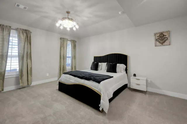 a bedroom with a bed and window