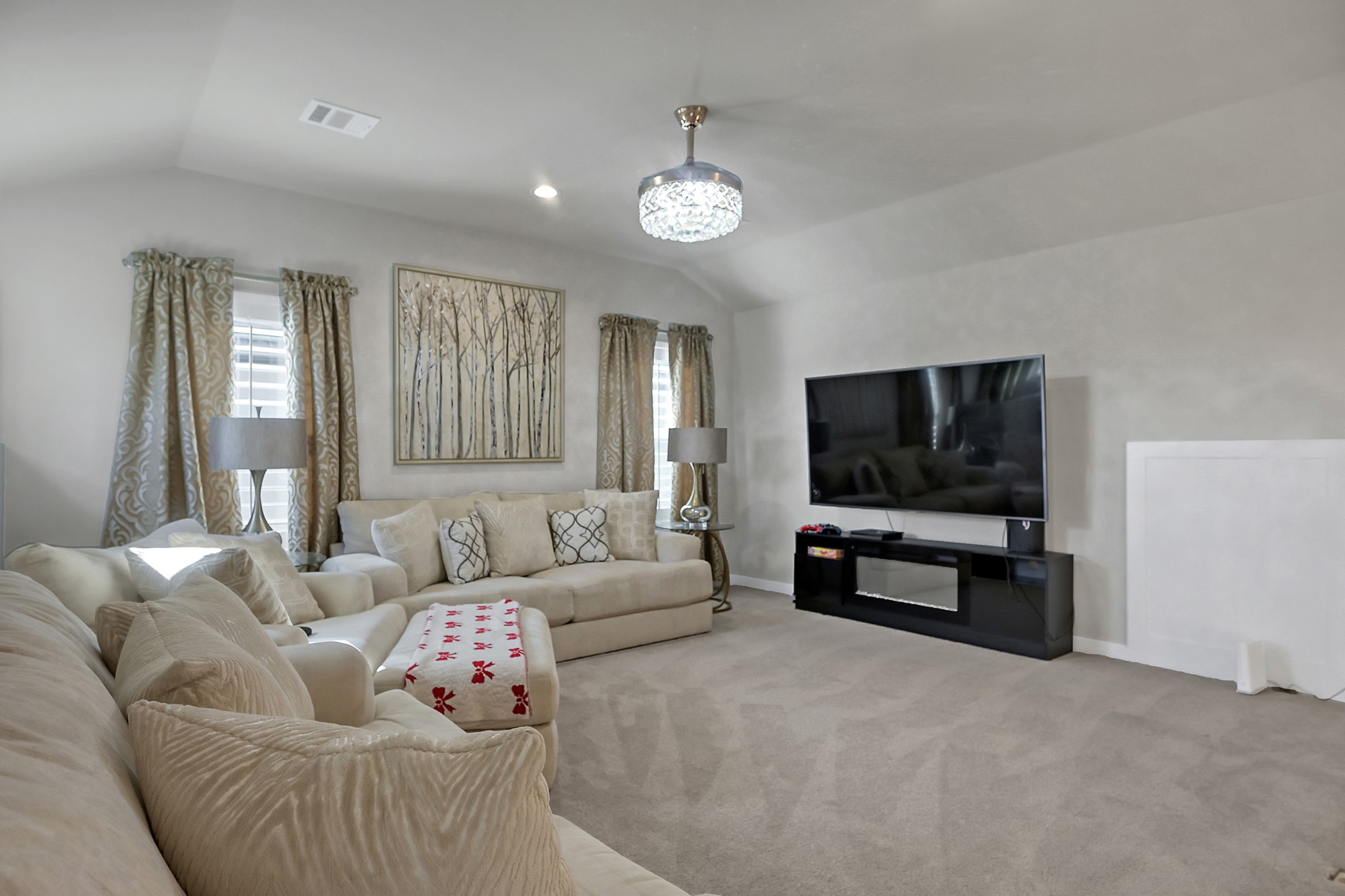 3131 Red Buckeye Lane Conroe, TX 77301 - Photo 20 of 34 a living room with furniture and a flat screen tv