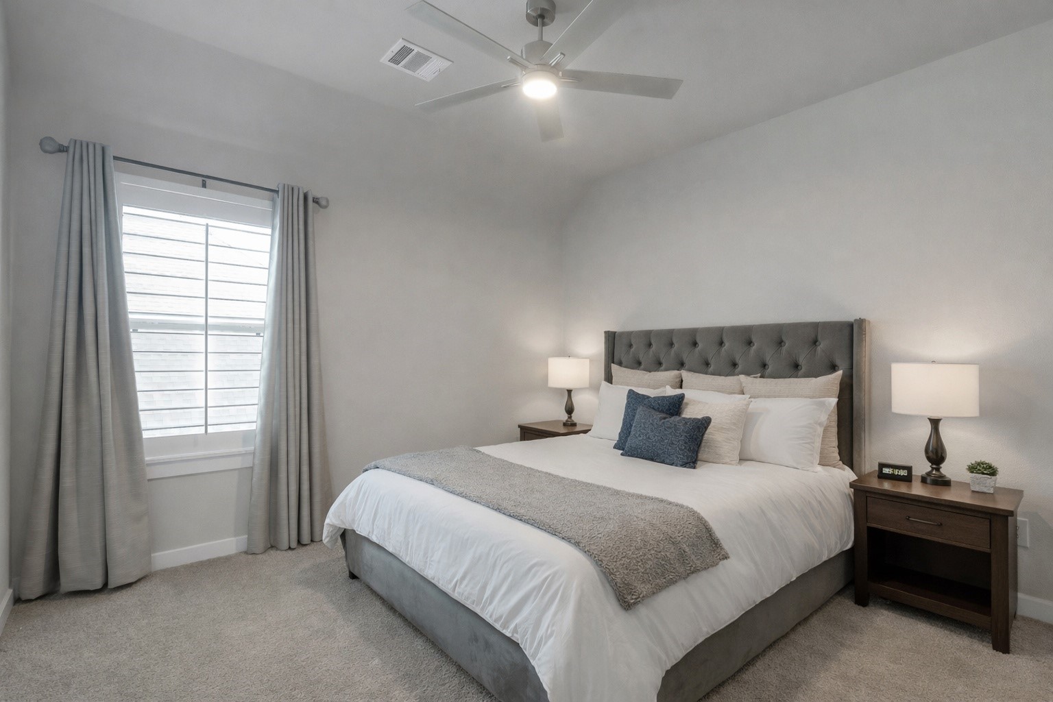 3131 Red Buckeye Lane Conroe, TX 77301 - Photo 22 of 34 a bedroom with a bed and a night stand