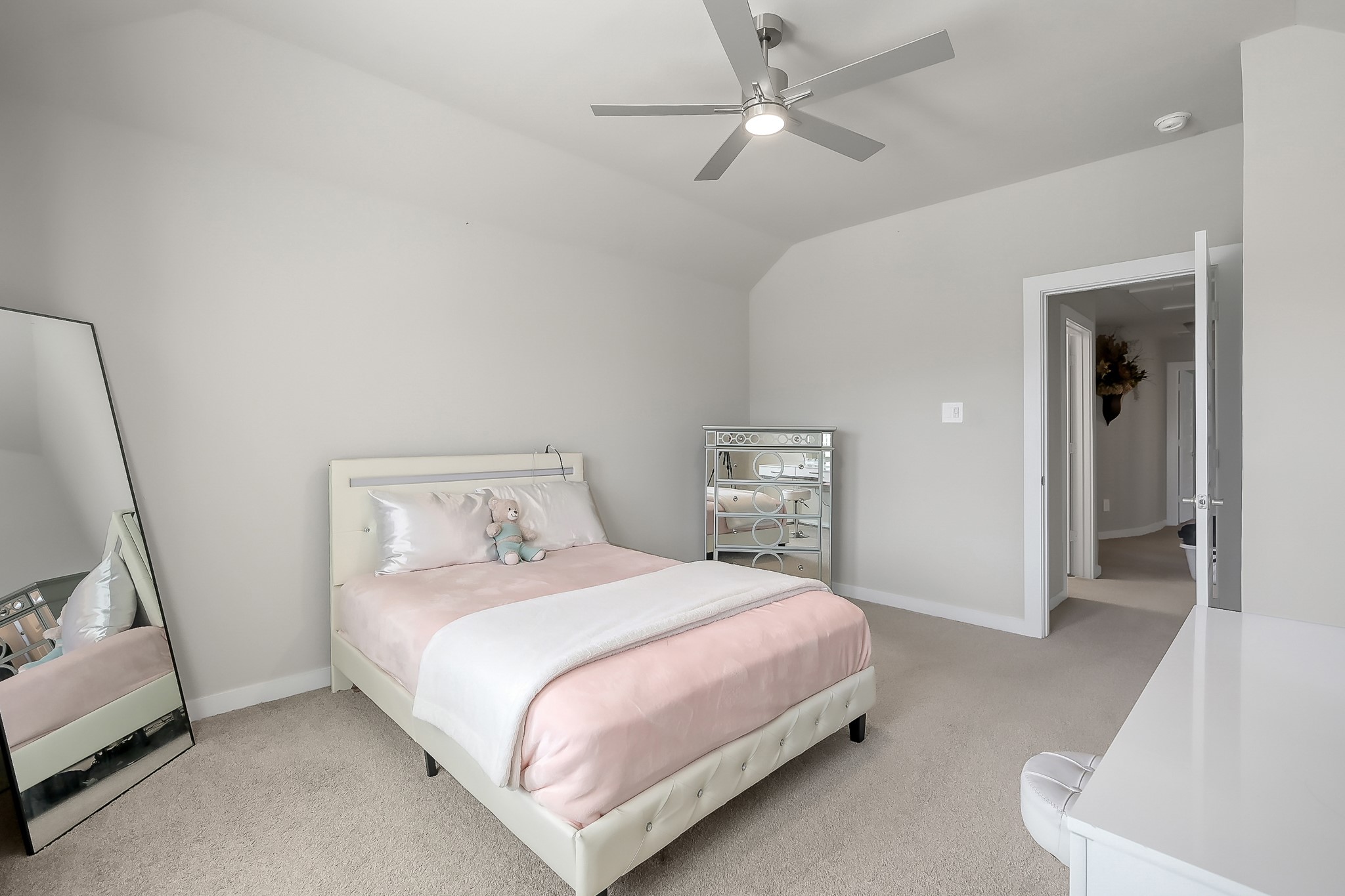 3131 Red Buckeye Lane Conroe, TX 77301 - Photo 24 of 34 a bedroom with a bed and a couch