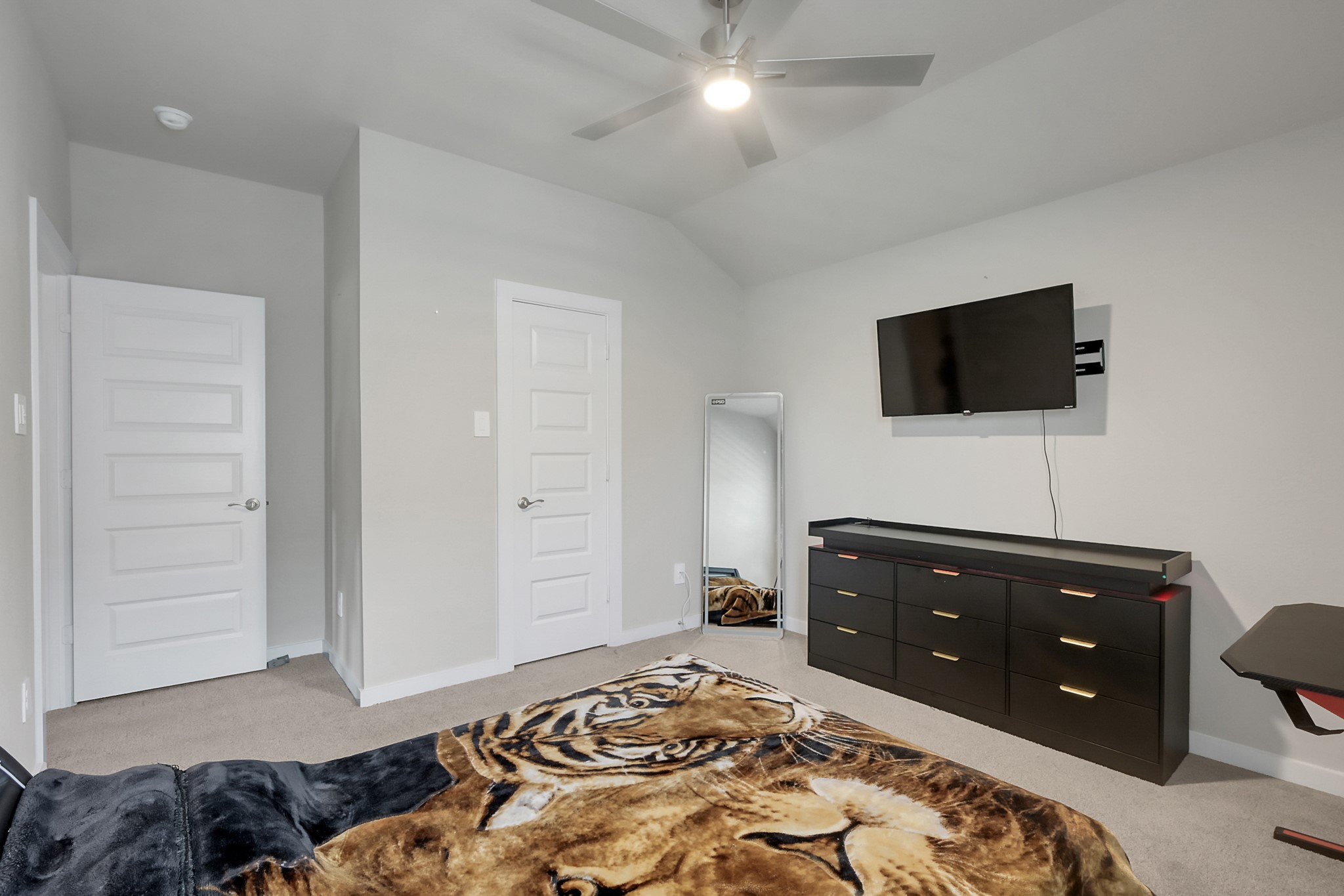 3131 Red Buckeye Lane Conroe, TX 77301 - Photo 27 of 34 a bedroom with a bed and a television