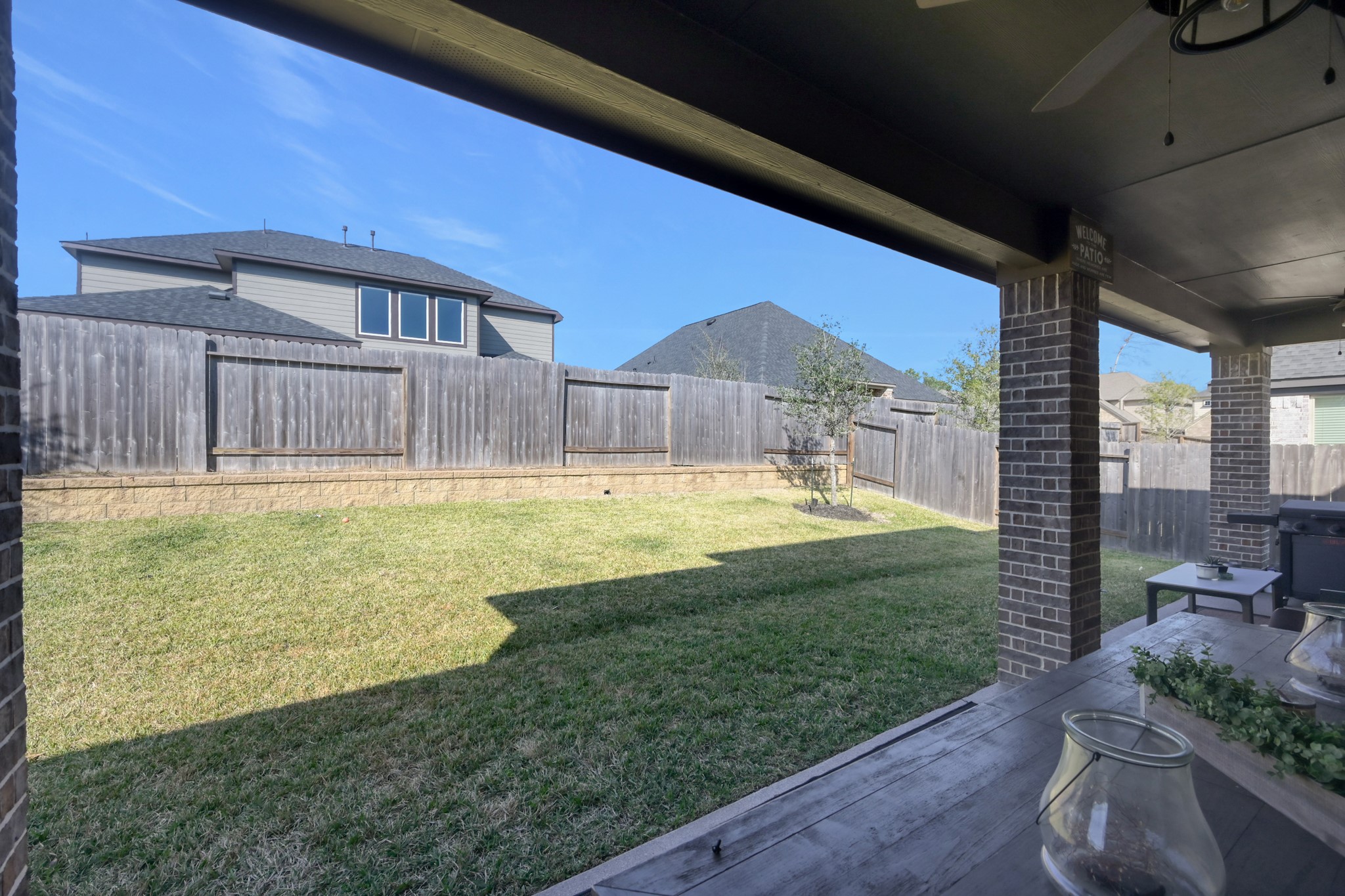 3131 Red Buckeye Lane Conroe, TX 77301 - Photo 30 of 34 a swimming pool with outdoor seating and yard