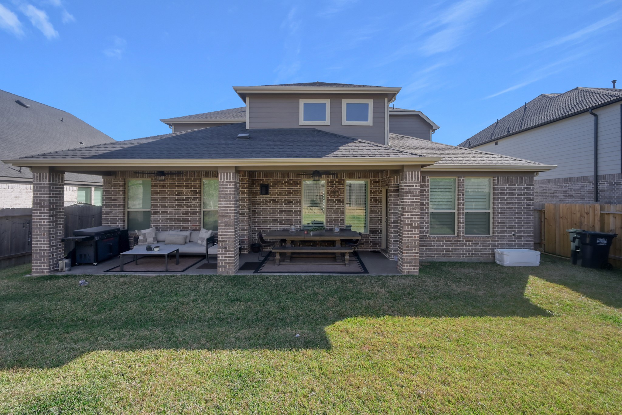 3131 Red Buckeye Lane Conroe, TX 77301 - Photo 31 of 34 a view of a house with a yard porch and sitting area