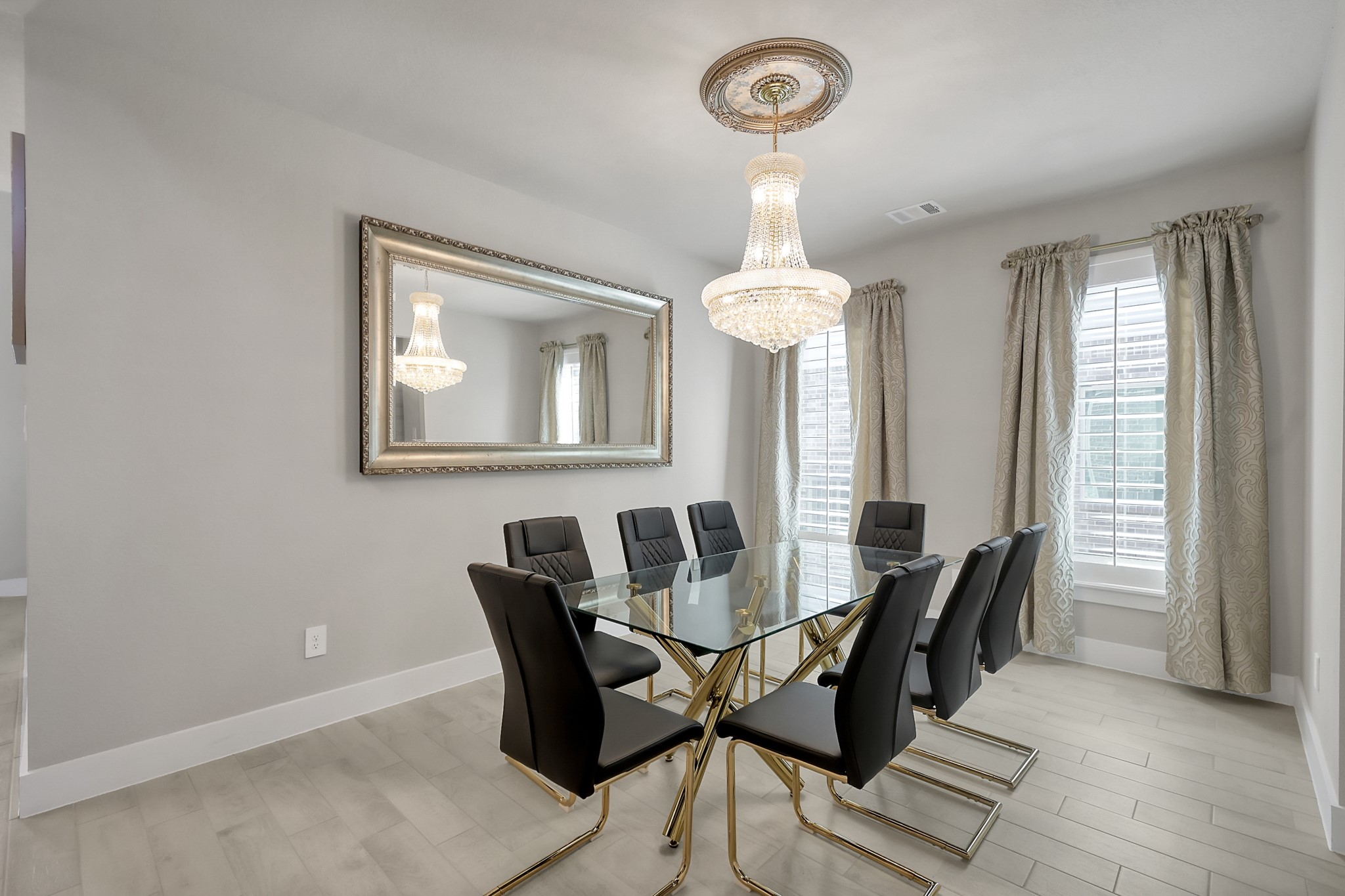 3131 Red Buckeye Lane Conroe, TX 77301 - Photo 6 of 34 a view of a dining room with furniture and a chandelier