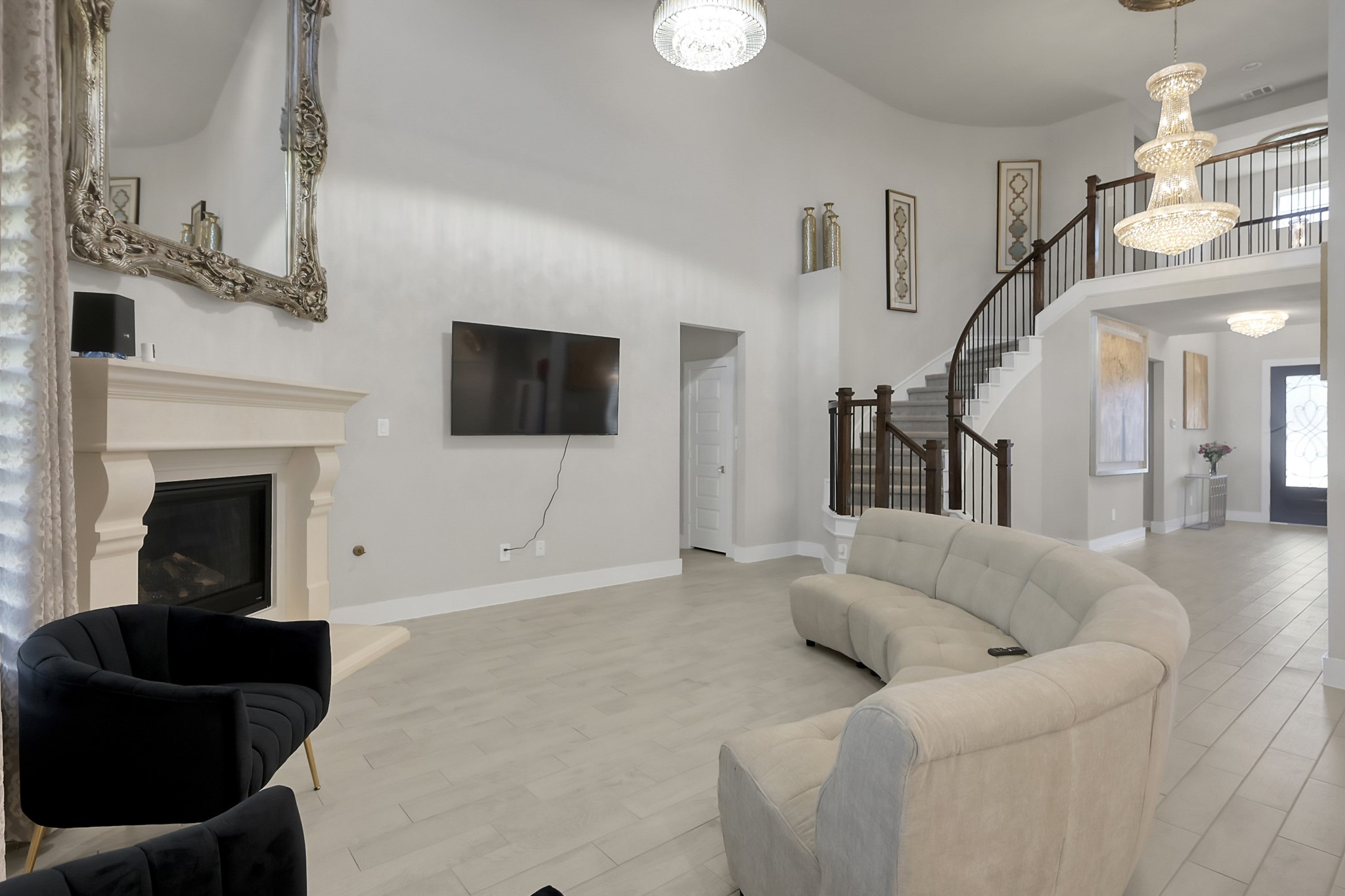 3131 Red Buckeye Lane Conroe, TX 77301 - Photo 8 of 34 a living room with furniture and a flat screen tv