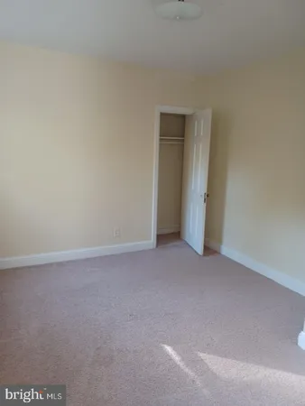 a view of an empty room and closet