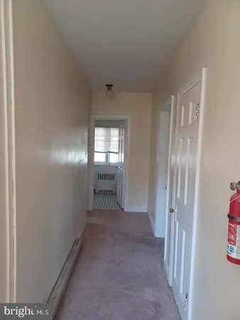 a view of hallway with windows