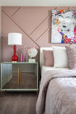 a spacious bedroom with a bed and furniture