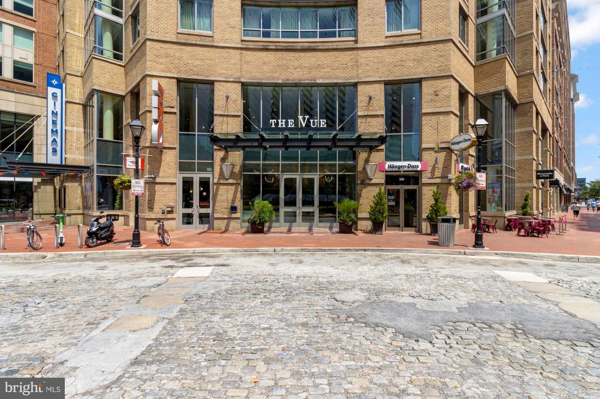 675 President Street, Unit 1406 Baltimore, MD 21202 - Photo 1 of 30 a view of a street with a building and trees