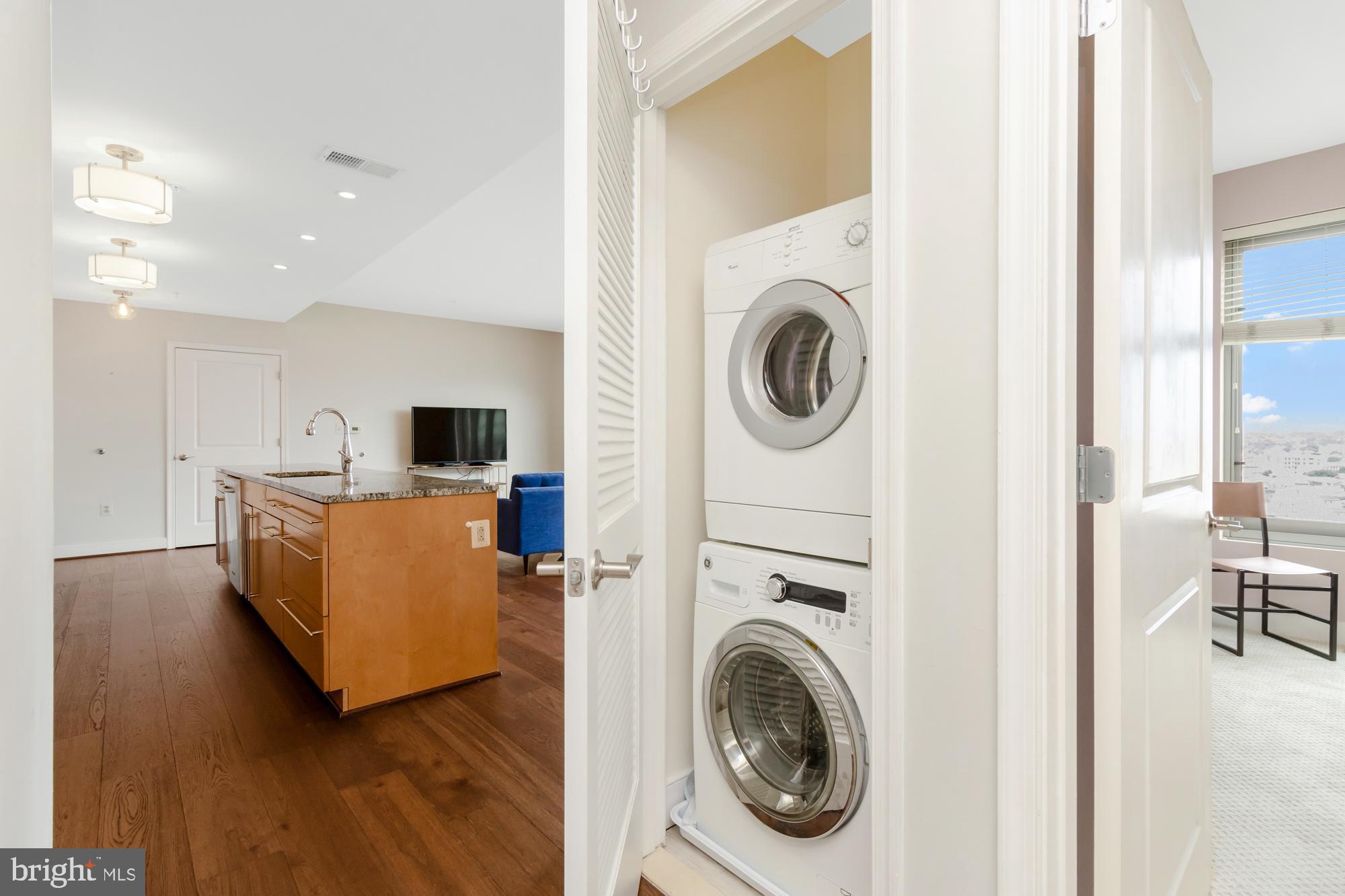 675 President Street, Unit 1406 Baltimore, MD 21202 - Photo 15 of 30 a living room with furniture and a flat screen tv