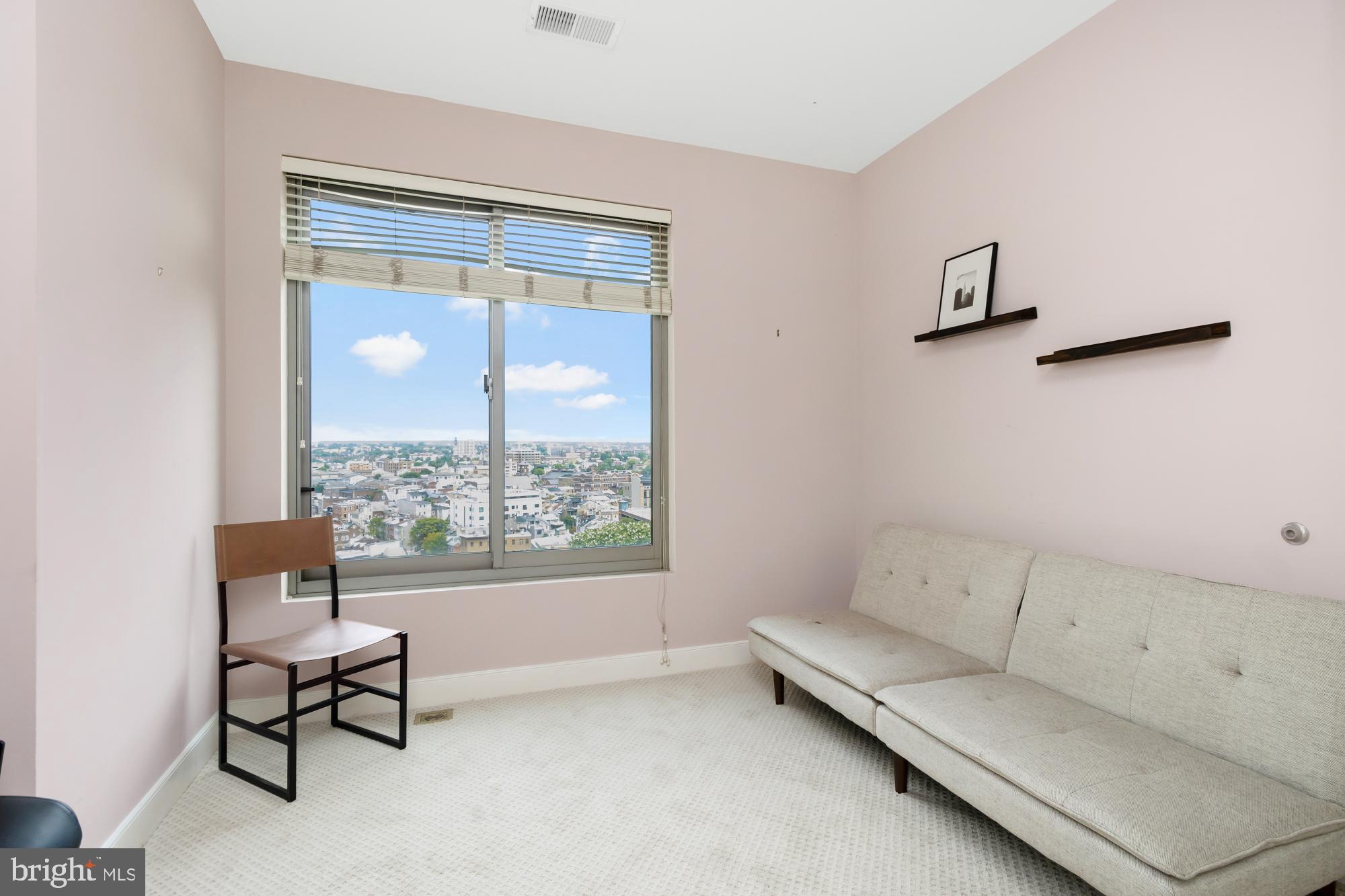 675 President Street, Unit 1406 Baltimore, MD 21202 - Photo 16 of 30 a living room with furniture and a window