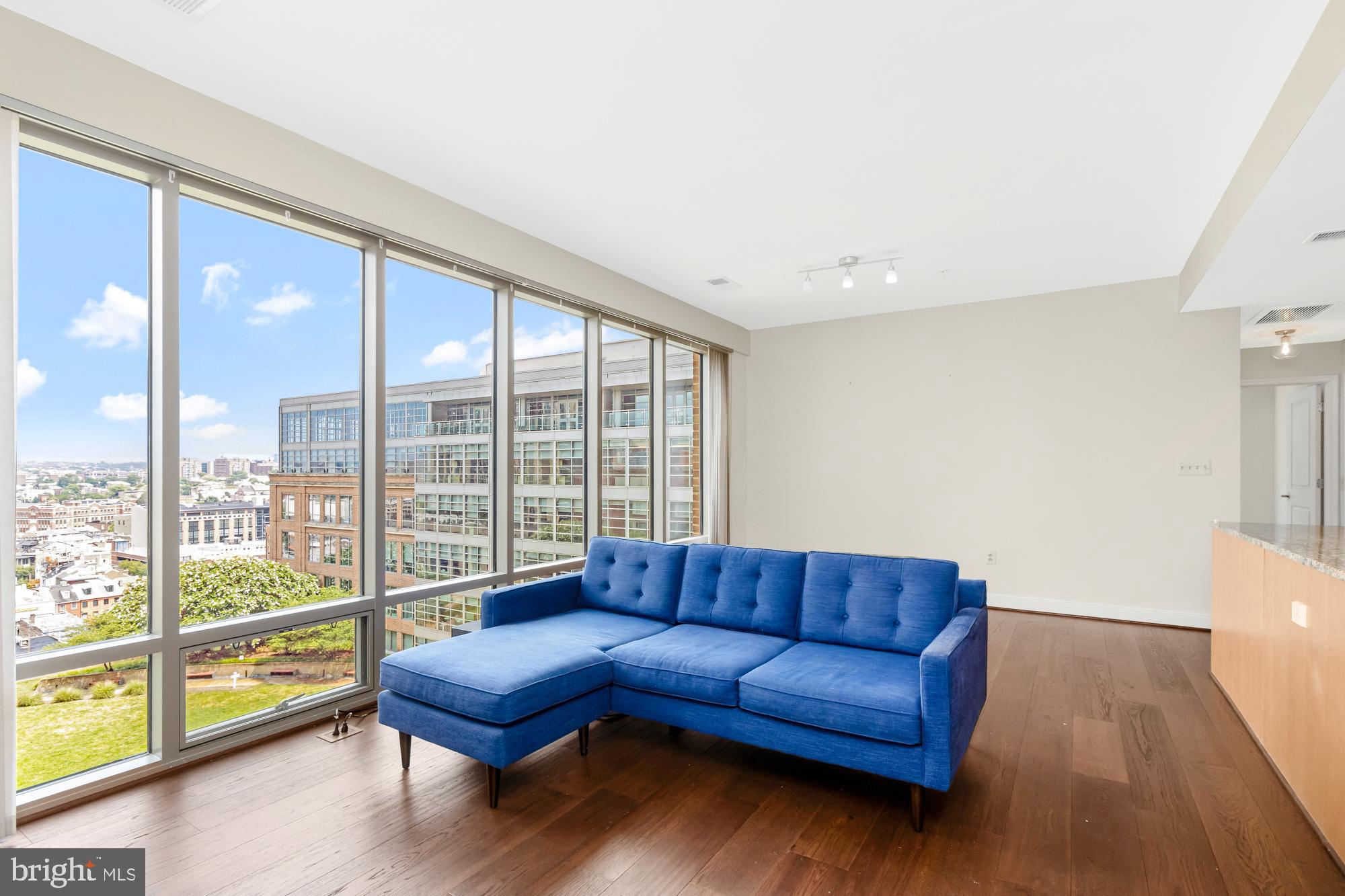 675 President Street, Unit 1406 Baltimore, MD 21202 - Photo 2 of 30 a living room with furniture and a large window