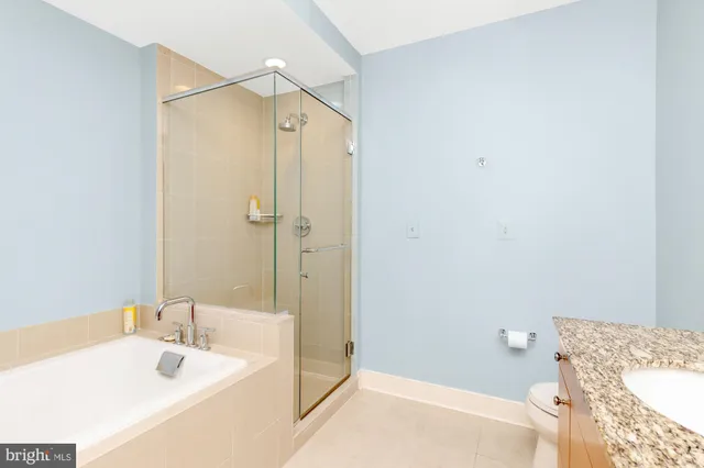 a bathroom with a tub and a sink