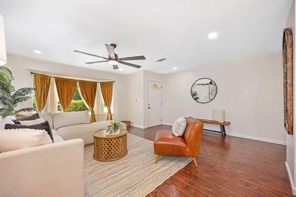 a living room with furniture and a large window