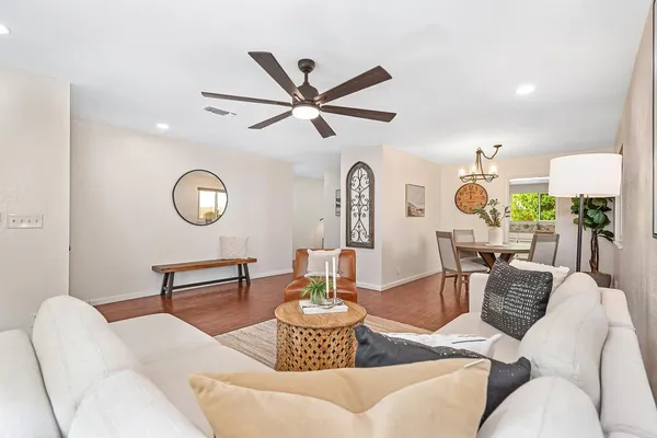 a living room with furniture and a fireplace