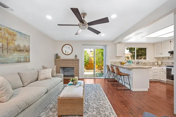 a living room with furniture and a rug
