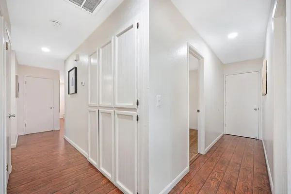 a bathroom with a granite countertop sink mirror and shower