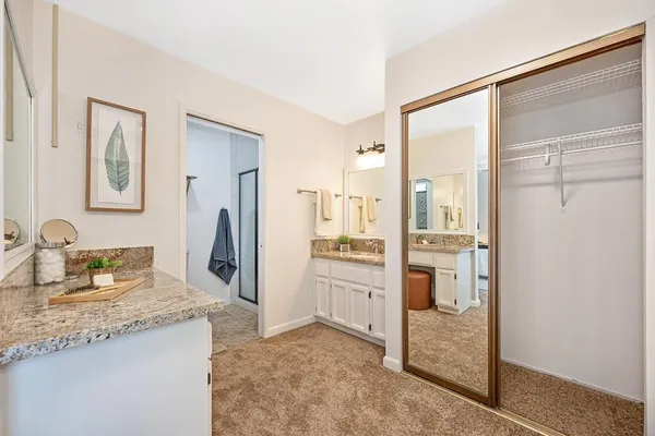 a view of a patio with couches table and chairs and potted plants