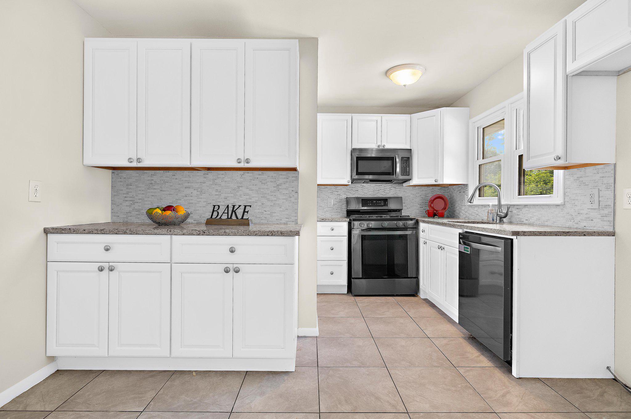 5822 Forest Hill Road Elkridge, MD 21075 - Photo 16 of 55 Updated, modern kitchen with white cabinets