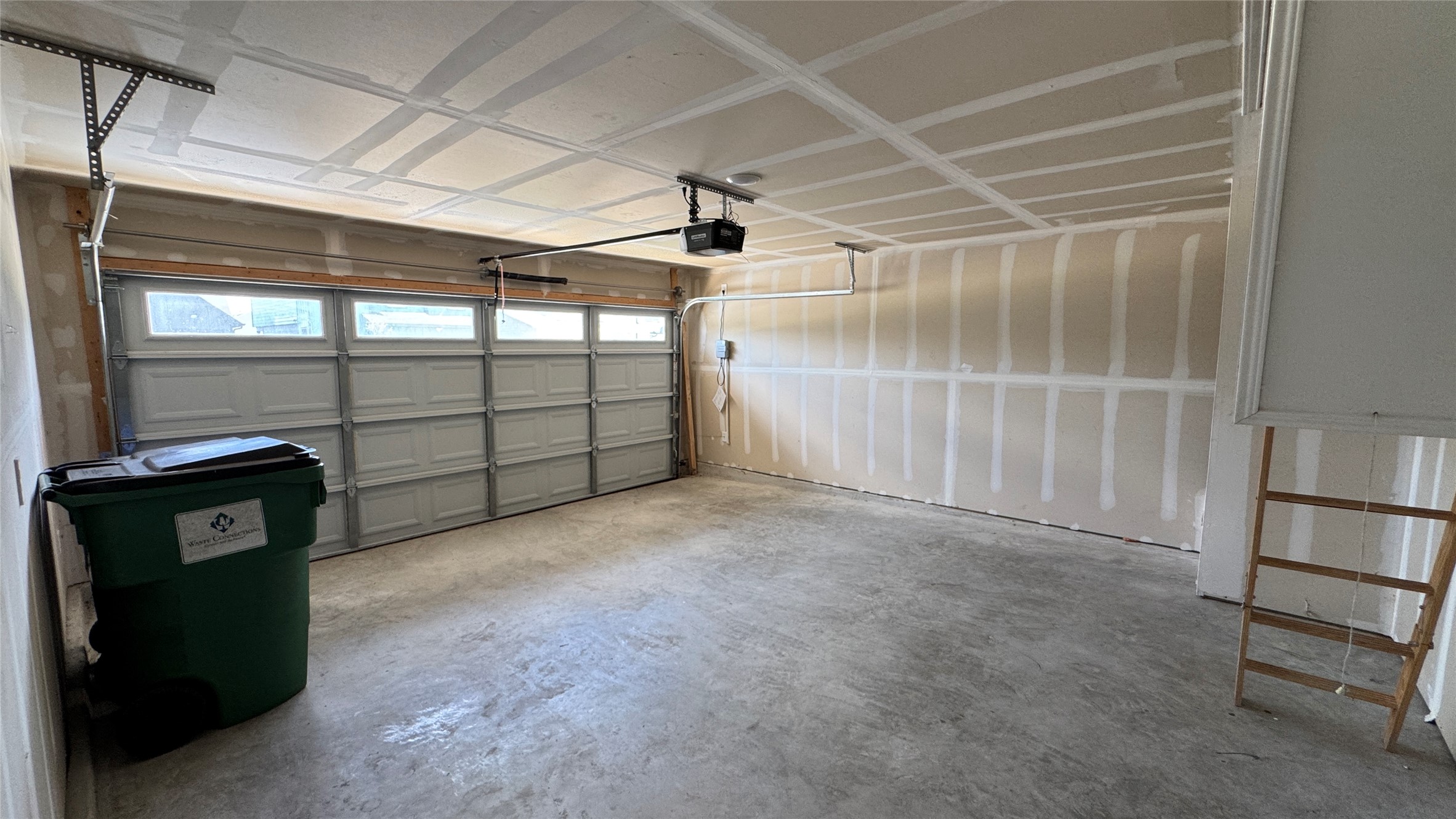 408 Frogmore Loop Kyle, TX 78640 - Photo 19 of 32 A spacious, clean garage offering ample storage and an automatic door opener.