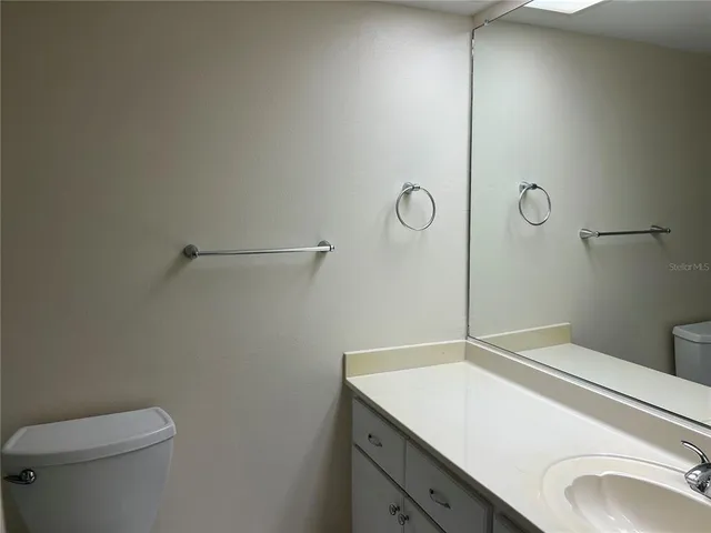 a bathroom with a sink and vanity