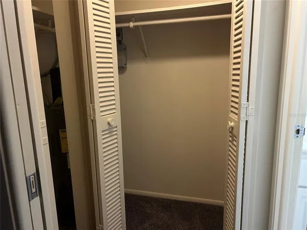 a bathroom with a window and a door