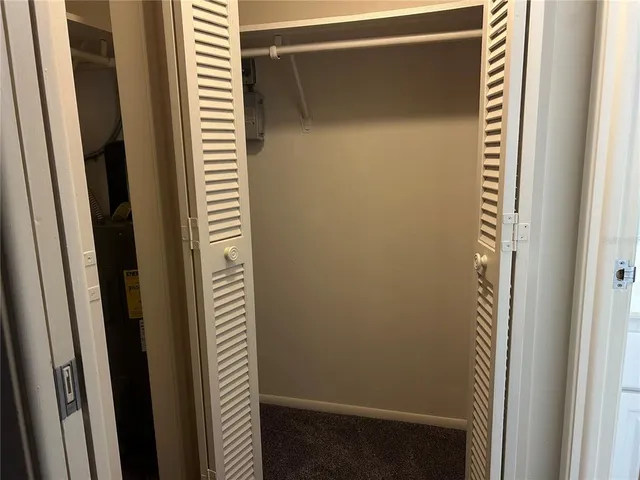 a bathroom with a window and a door