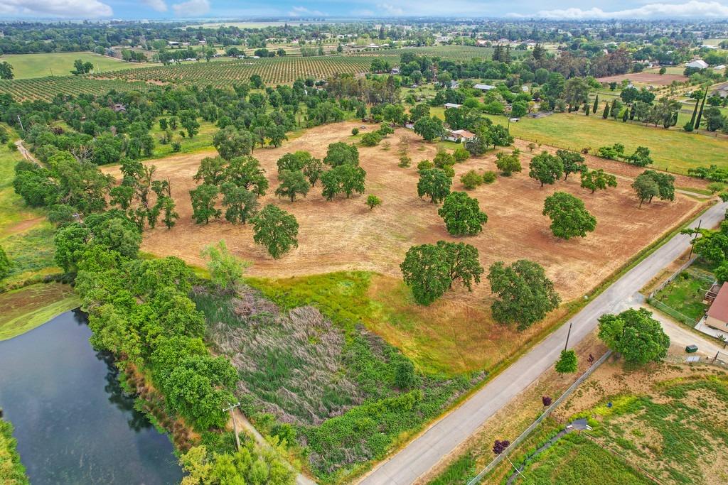 10843 Gay Road Wilton, CA 95693 - Photo 1 of 1 an aerial view of residential houses with outdoor space and river