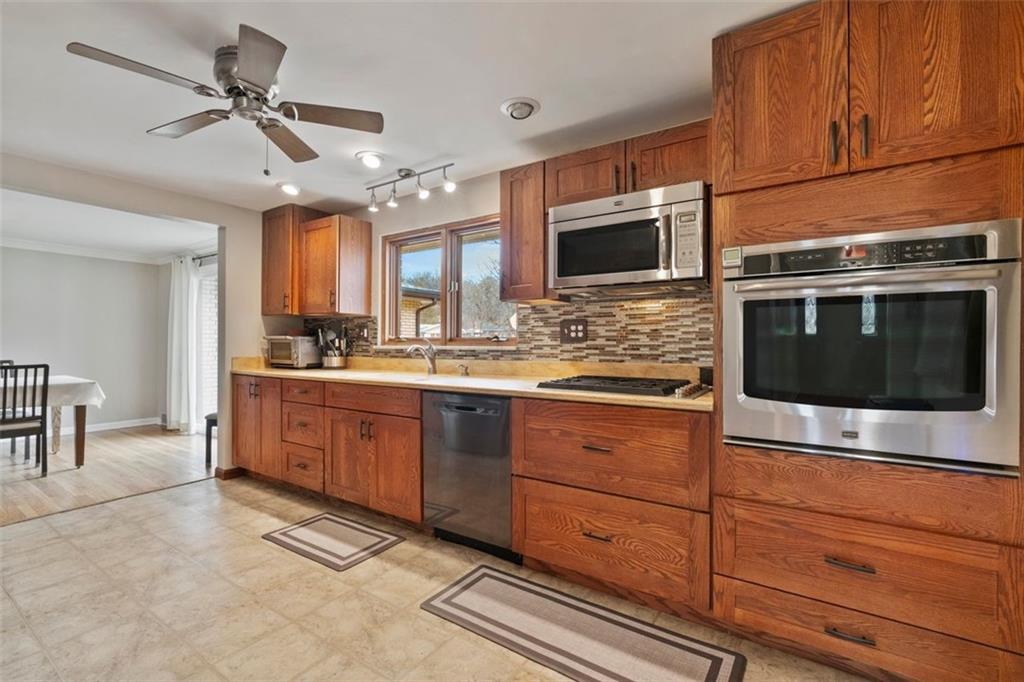 426 Thompsonville Road McMurray, PA 15317 - Photo 8 of 24 Spacious and updated 16' x 11' kitchen with plenty of counter space for the chef in your family! The kitchen overlooks the private back yard and driveway!