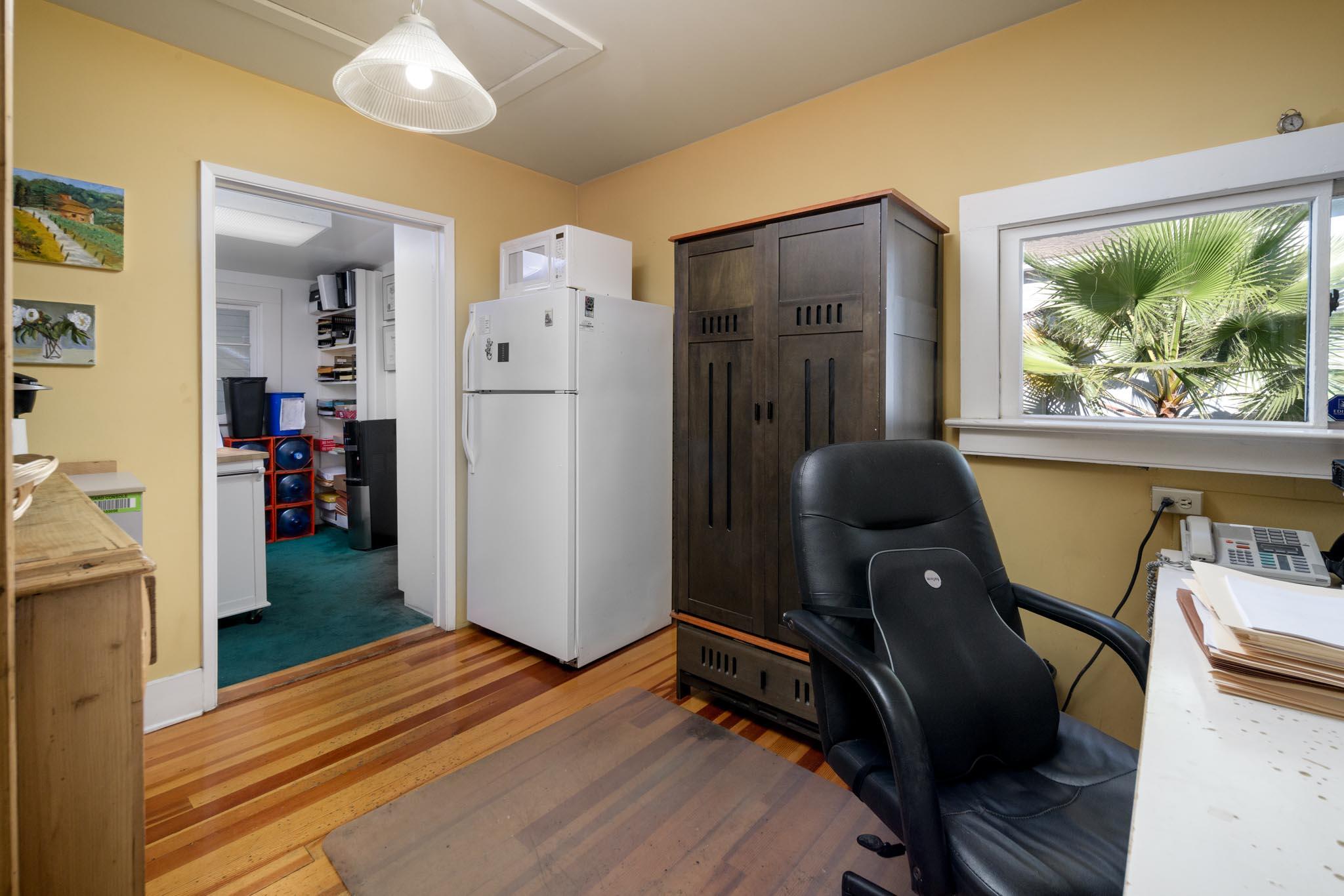 926 Garden Street Santa Barbara, CA 93101 - Photo 11 of 14 a view of a workspace with furniture and wooden floor