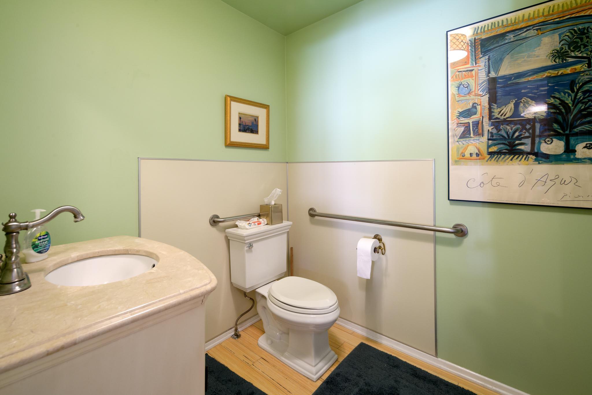 926 Garden Street Santa Barbara, CA 93101 - Photo 12 of 14 a bathroom with a granite countertop sink mirror vanity and toilet