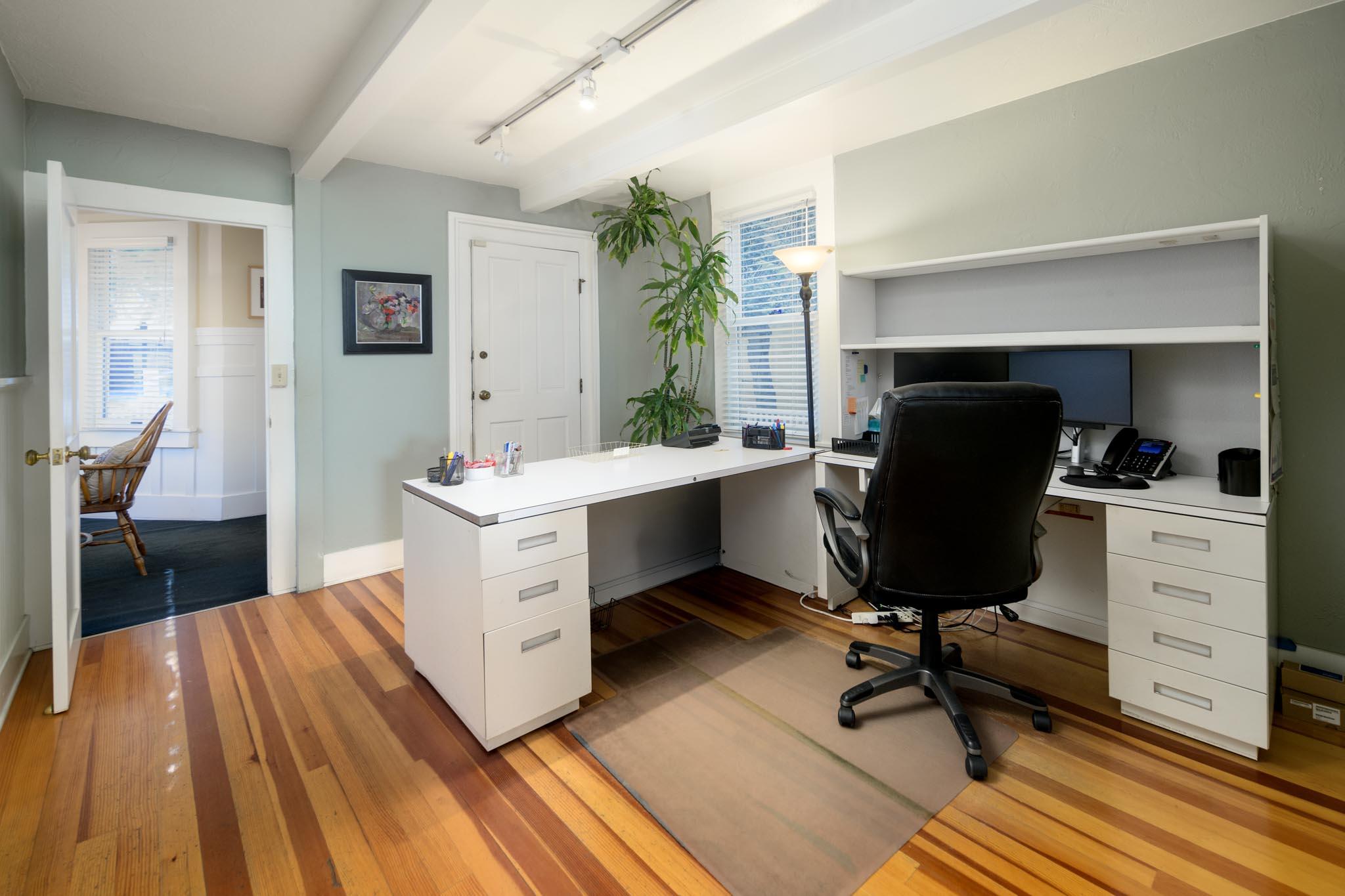 926 Garden Street Santa Barbara, CA 93101 - Photo 4 of 14 a room with a chair and a dresser
