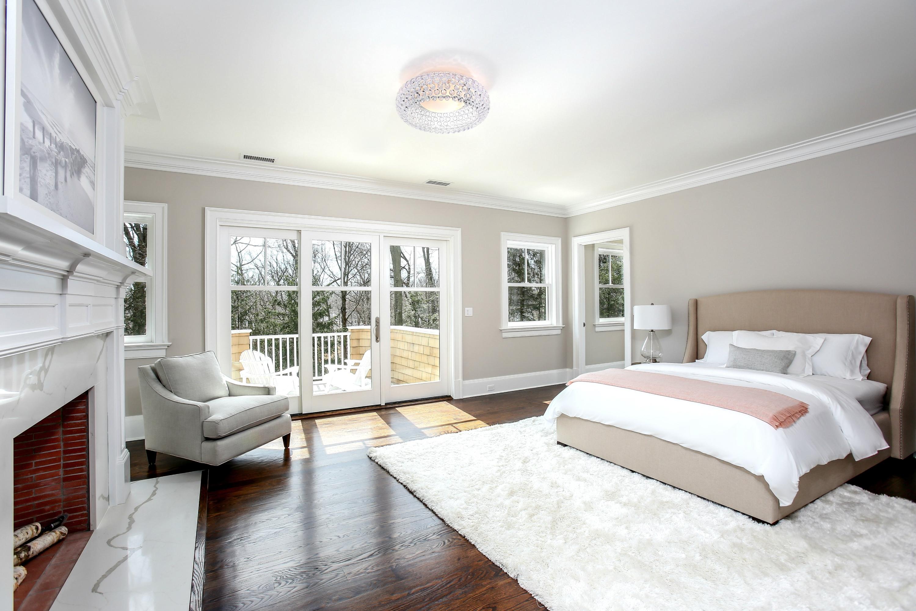 11 Sunswyck Road Darien, CT 06820 - Photo 12 of 25 a spacious bedroom with a large bed and a large window