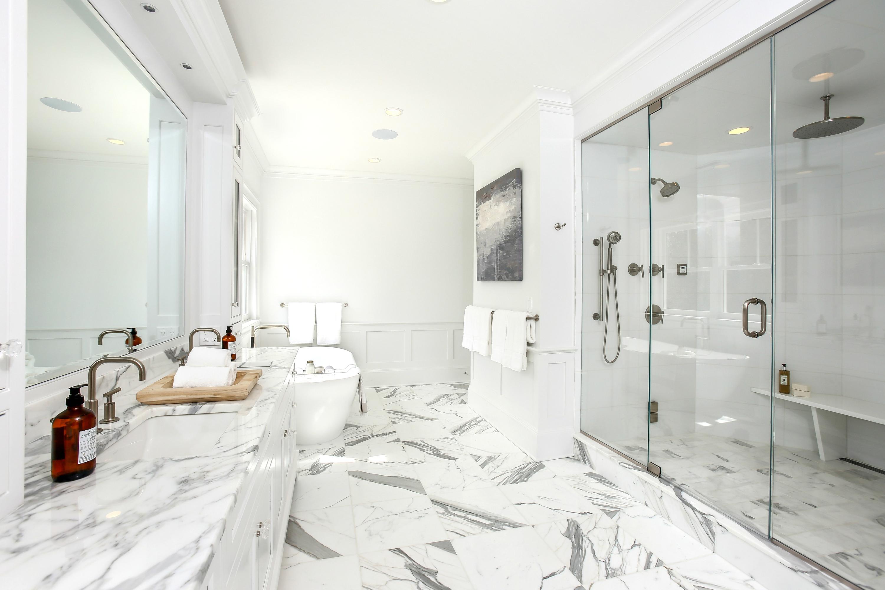 11 Sunswyck Road Darien, CT 06820 - Photo 14 of 25 a bedroom with a bed and a chandelier