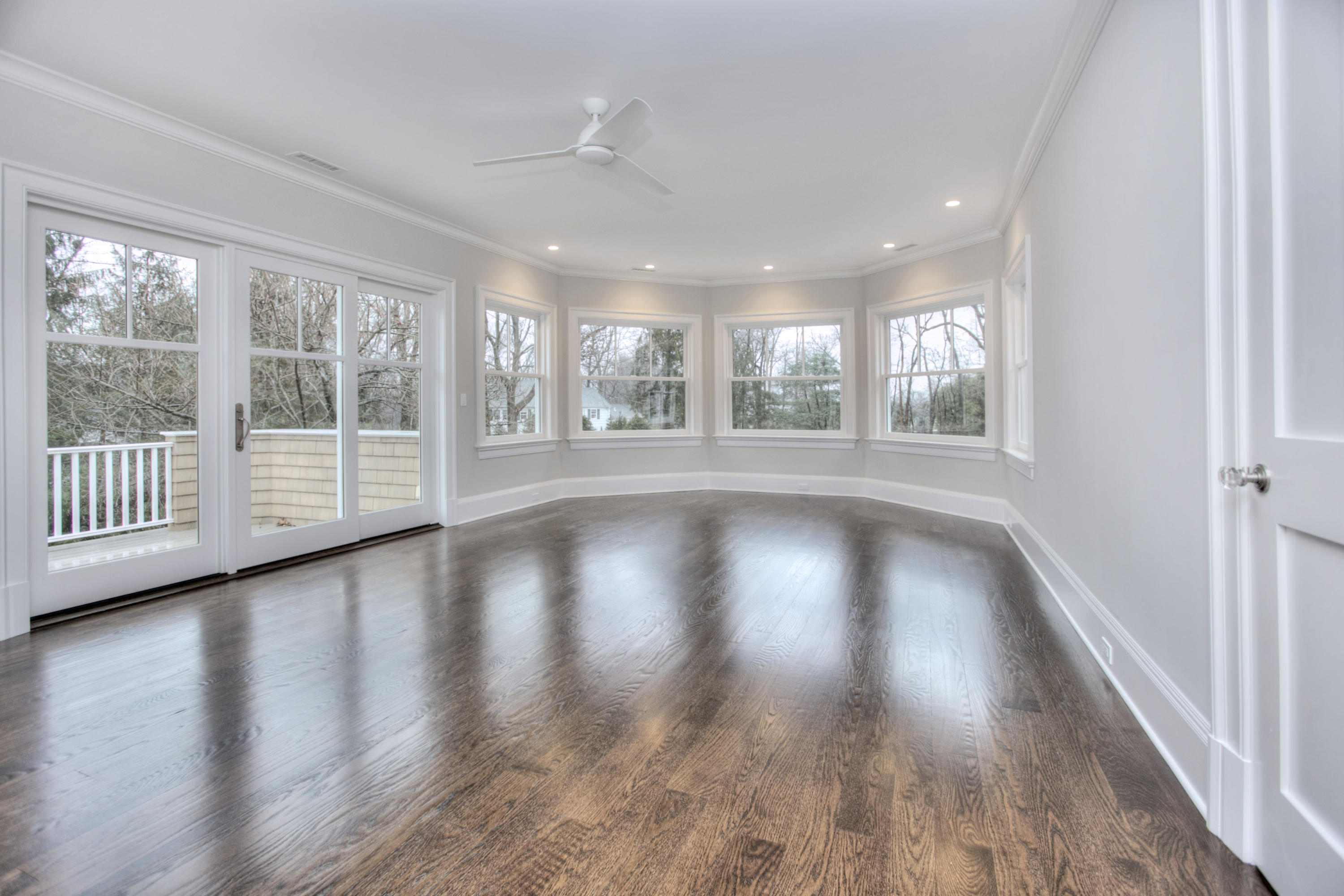 11 Sunswyck Road Darien, CT 06820 - Photo 15 of 25 an empty room with wooden floor and windows