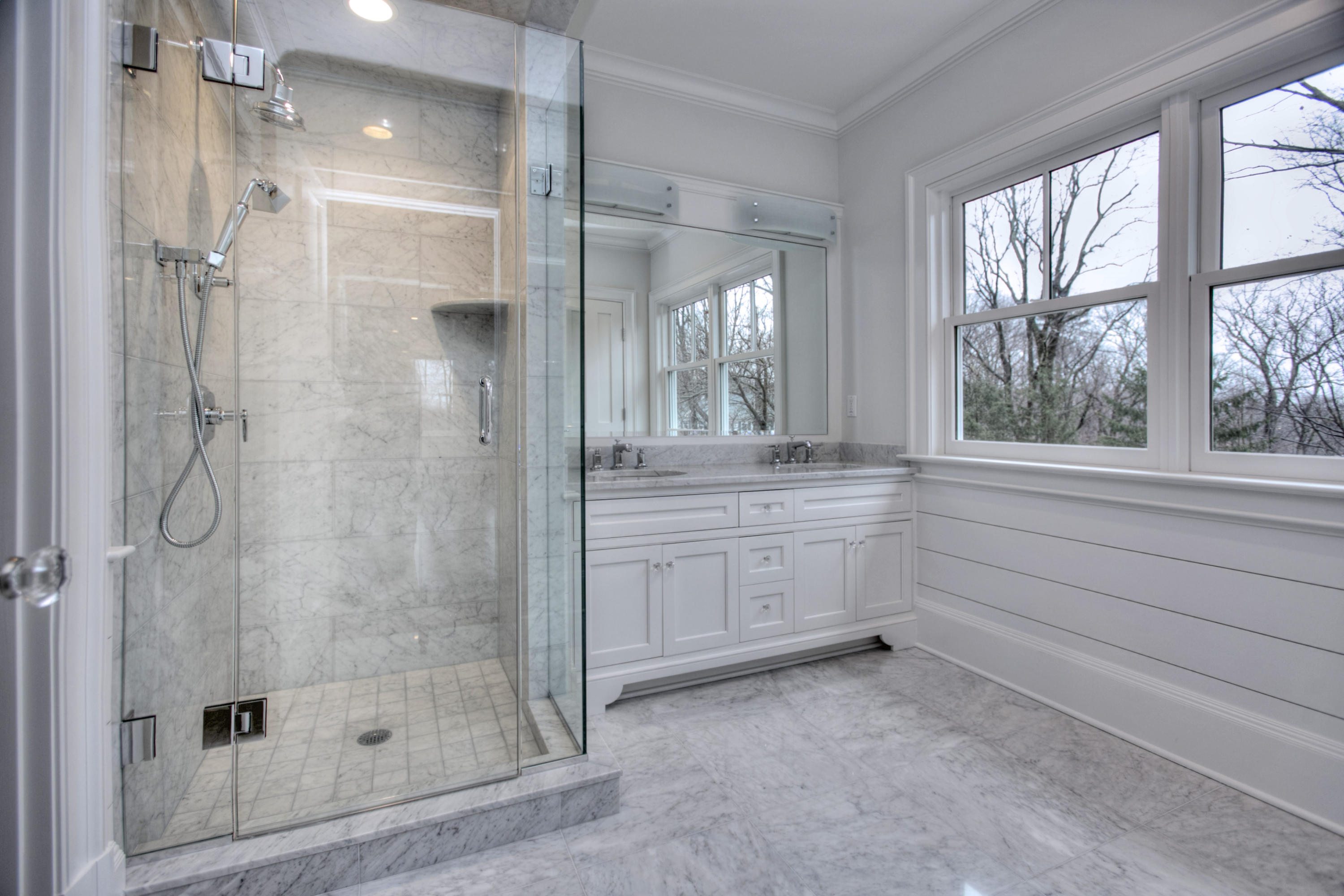 11 Sunswyck Road Darien, CT 06820 - Photo 16 of 25 a bathroom with a shower sink and mirror