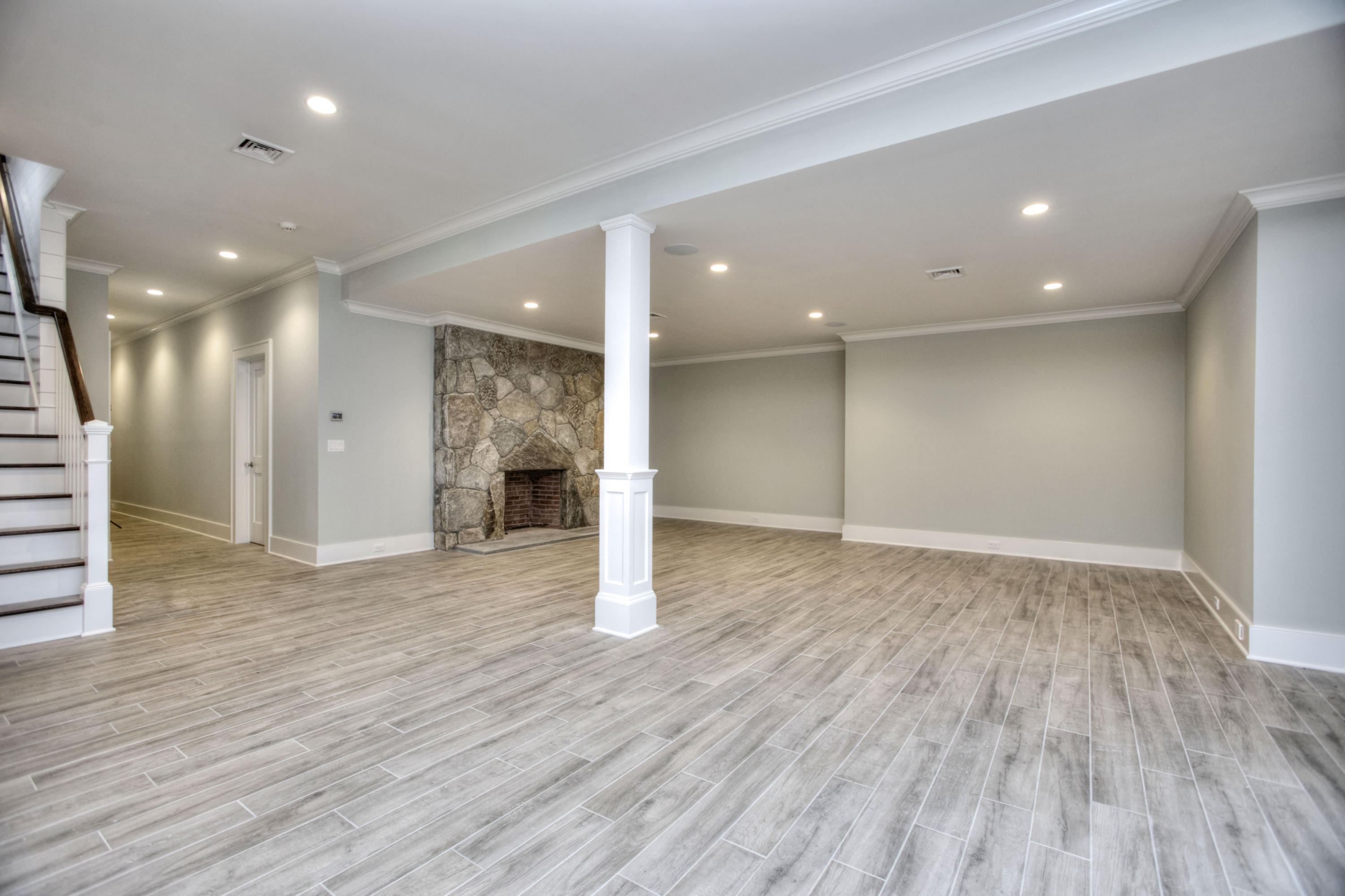 11 Sunswyck Road Darien, CT 06820 - Photo 20 of 25 a view of an empty room with wooden floor and a window