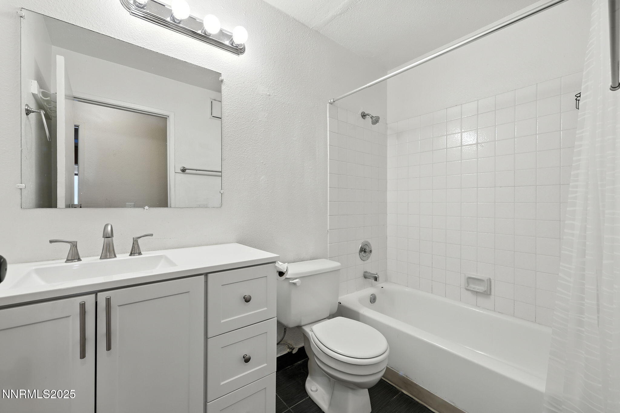 2101 Highview Court, Unit 9 Reno, NV 89512 - Photo 12 of 15 a bathroom with a granite countertop sink toilet and shower