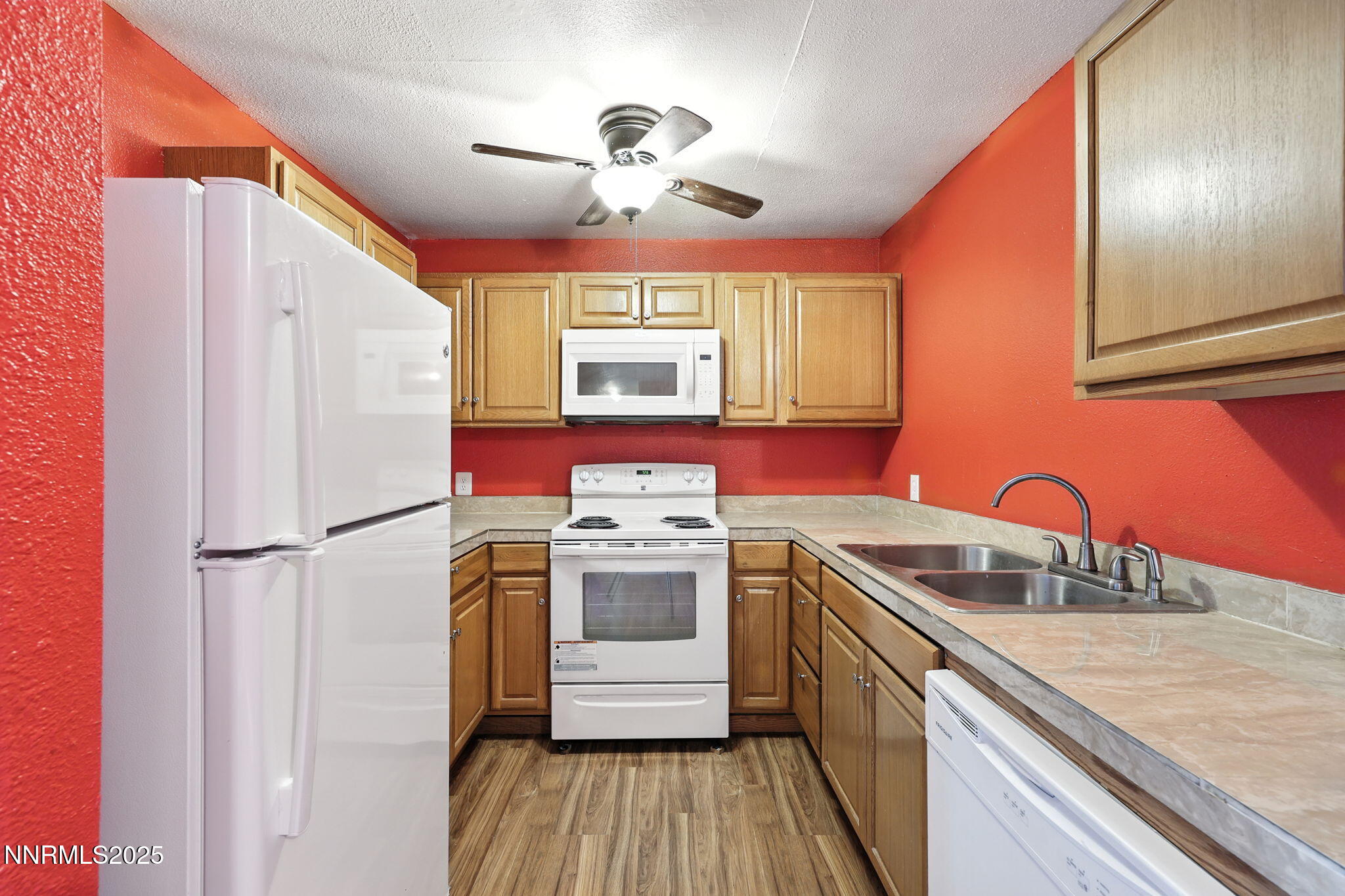 2101 Highview Court, Unit 9 Reno, NV 89512 - Photo 13 of 15 a kitchen with stainless steel appliances granite countertop a sink stove and refrigerator