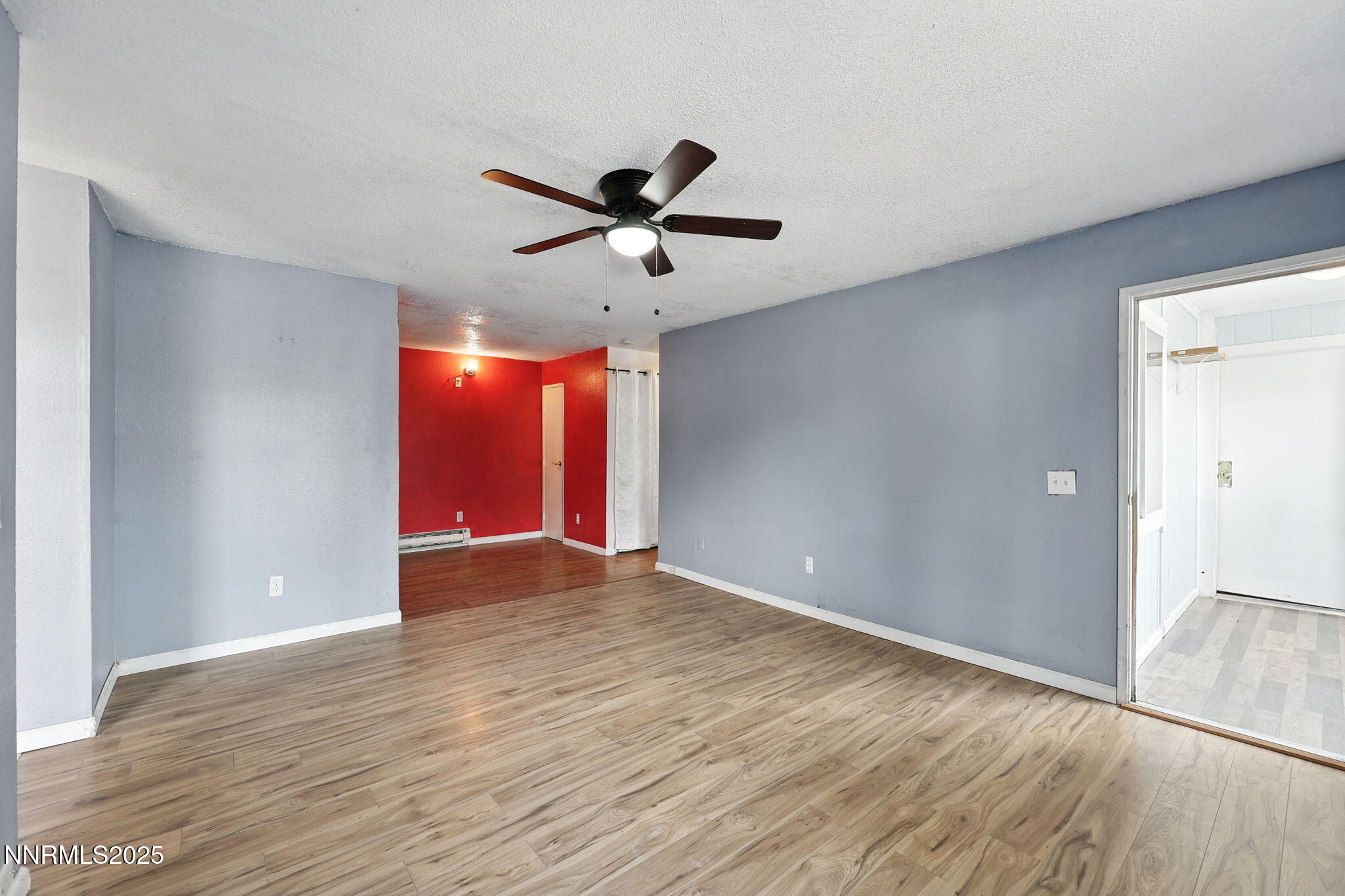 2101 Highview Court, Unit 9 Reno, NV 89512 - Photo 14 of 15 a view of an empty room and window and wooden floor