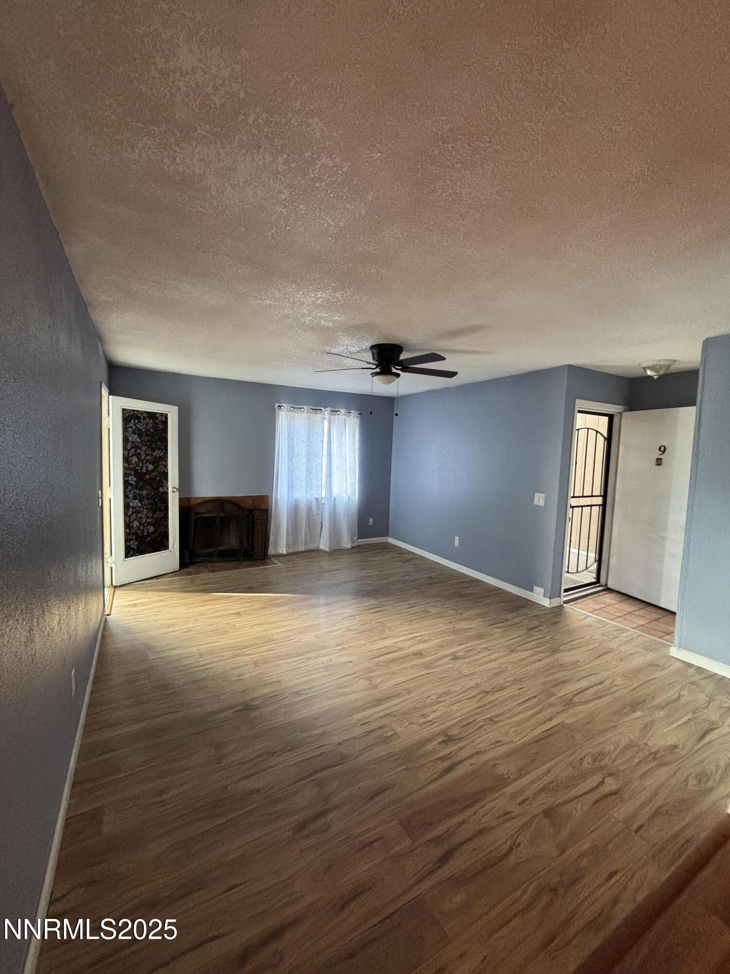 2101 Highview Court, Unit 9 Reno, NV 89512 - Photo 2 of 15 a view of empty room with wooden floor