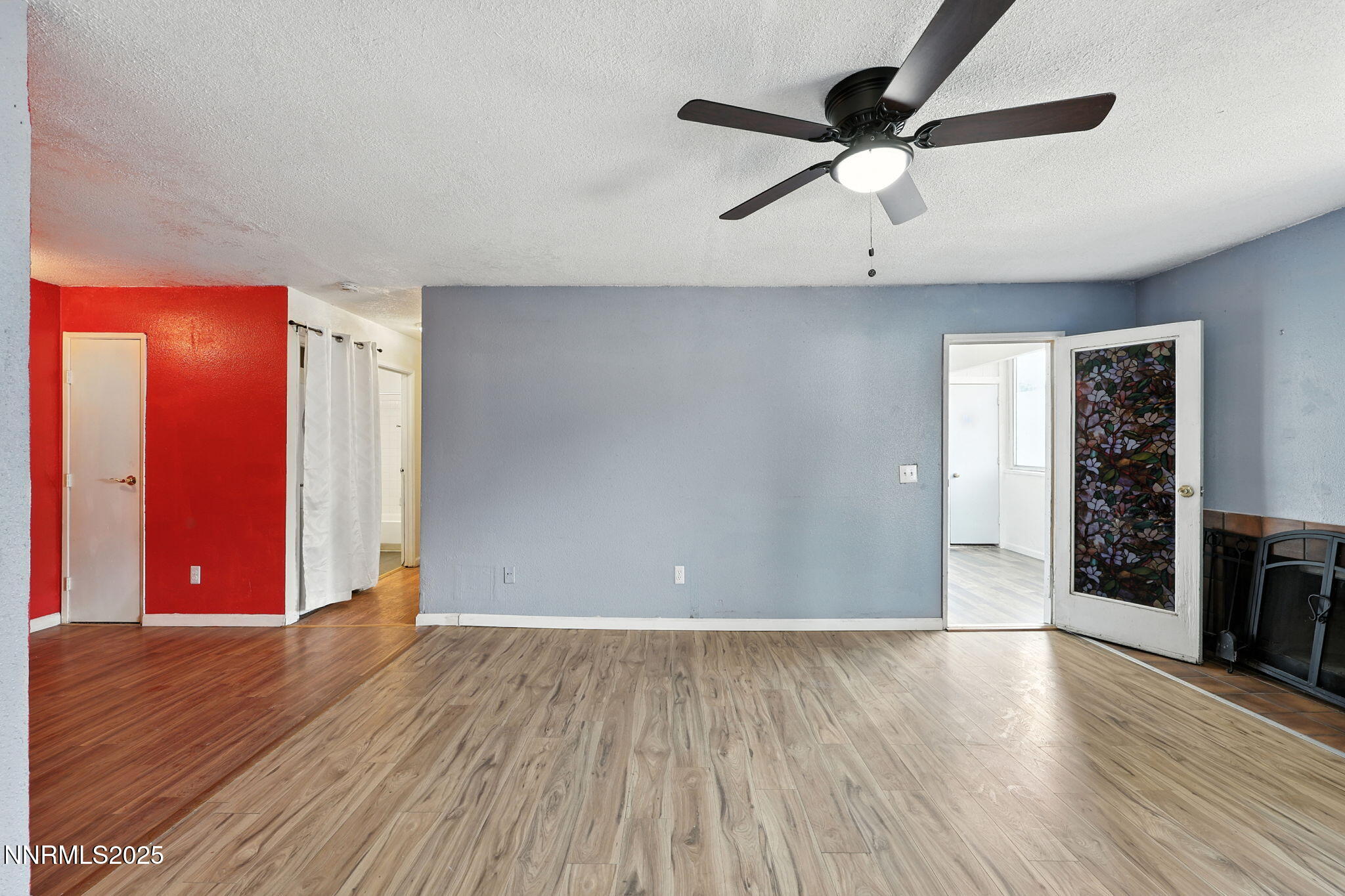 2101 Highview Court, Unit 9 Reno, NV 89512 - Photo 9 of 15 wooden floor in an empty room with a window